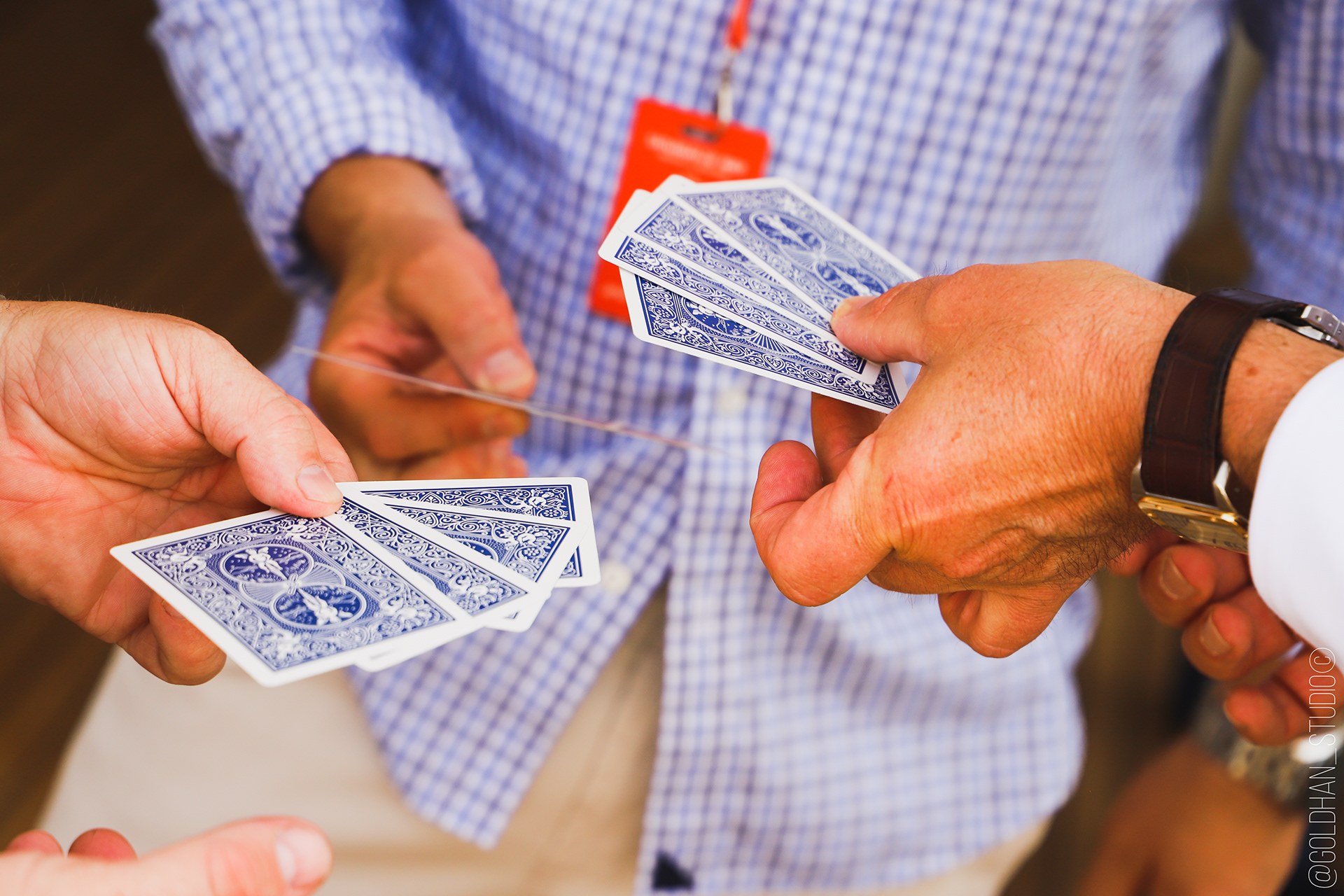 Guests amazed by a close-up magic performance